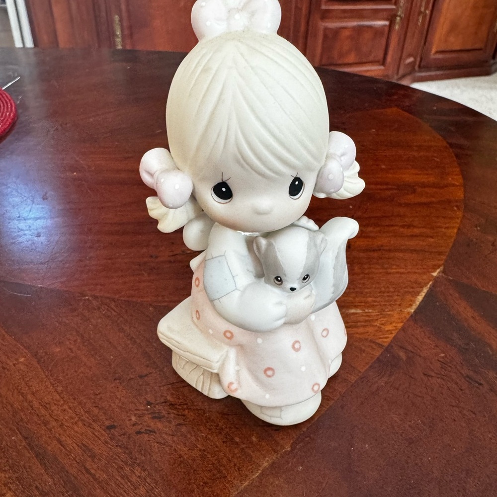 Precious Moments Figurine scent from above with skunk